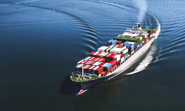 Photo showing a container ship in the open sea